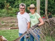 Peggy and her husband, Marty, at a Town cleanup event