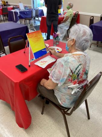 Photo of a woman painting