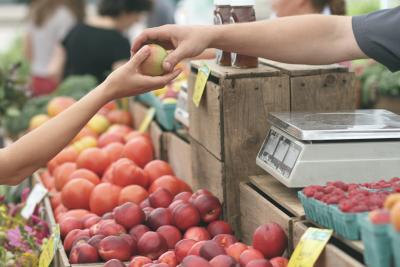 Photo of customer picking fruit at a grocery store