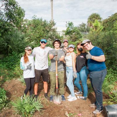 Photo of students cleaning up restoration site