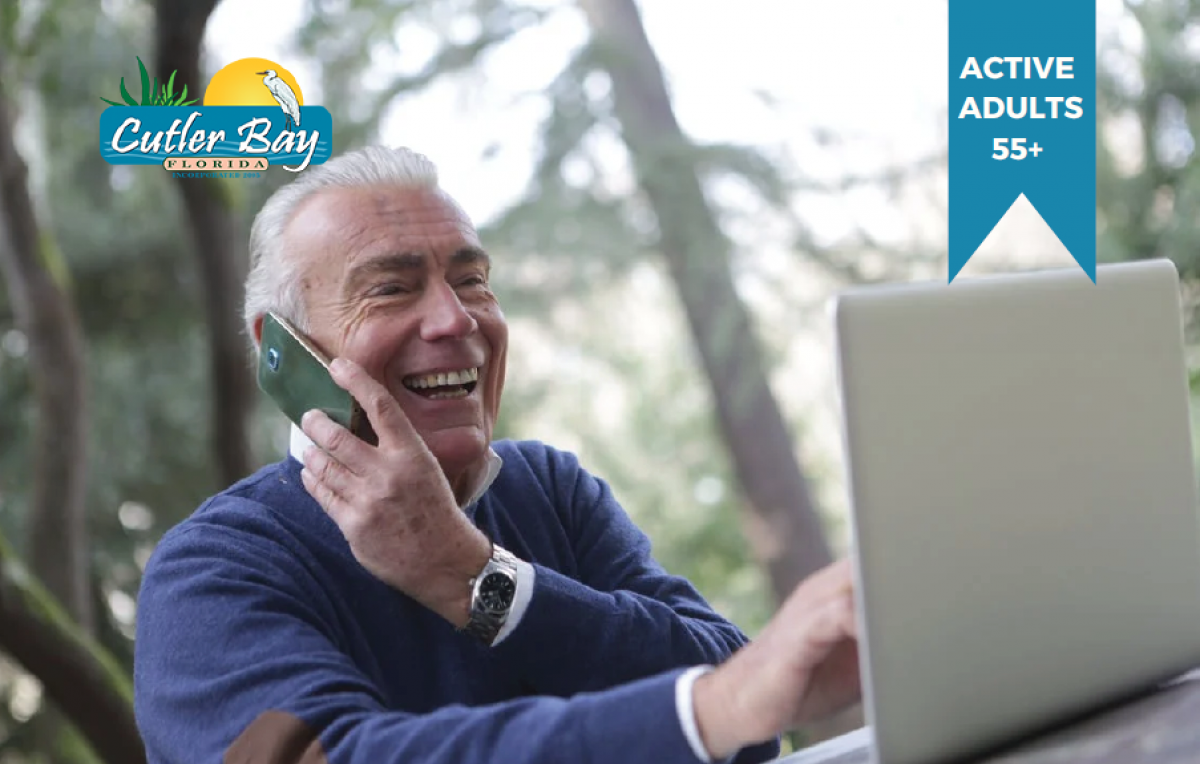 Photo of senior man on computer and mobile phone