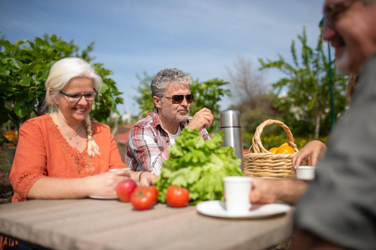 Photo of seniors eating outside