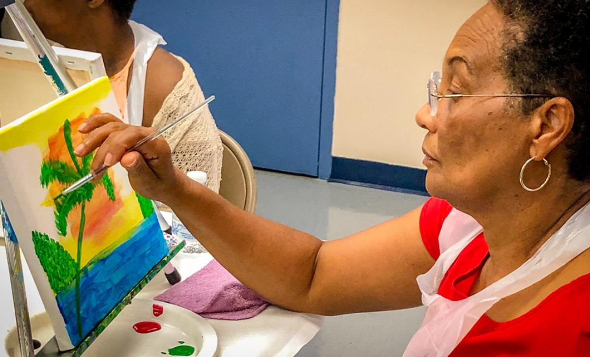 Woman Painting on small canvas